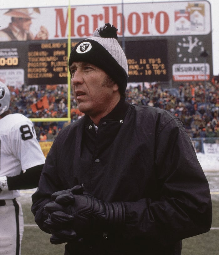 Tom Flores on the field before a playoff game in Cleveland after the 1980 season